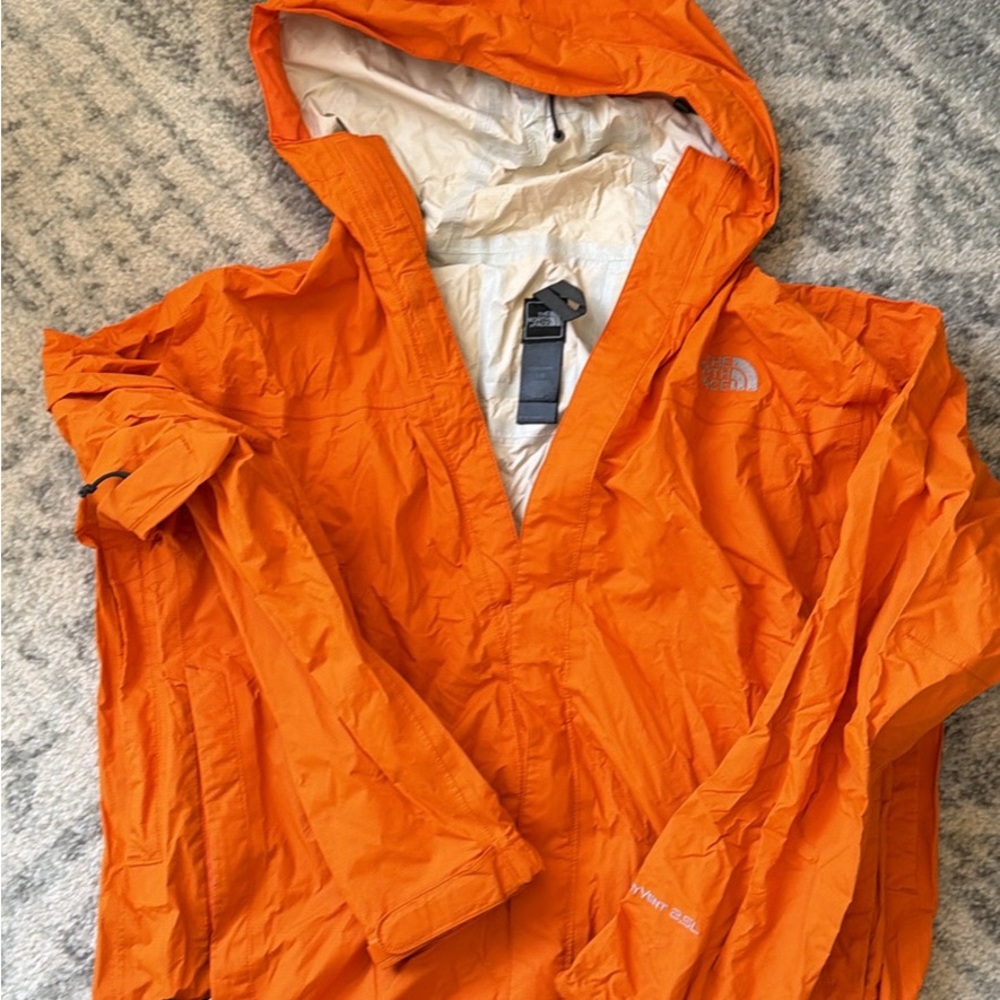 The North Face Orange Shell Jacket with Black Logo Tag